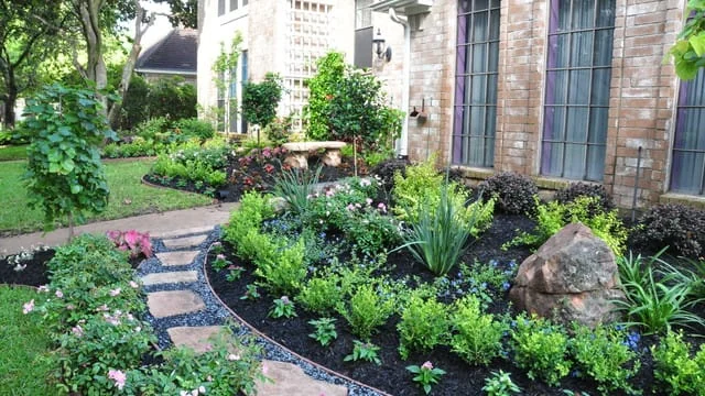 Maintained planting bed beside an Omaha-area home