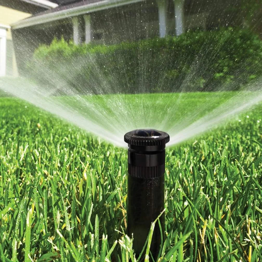 Irrigation sprinkler watering a lawn in the Omaha area